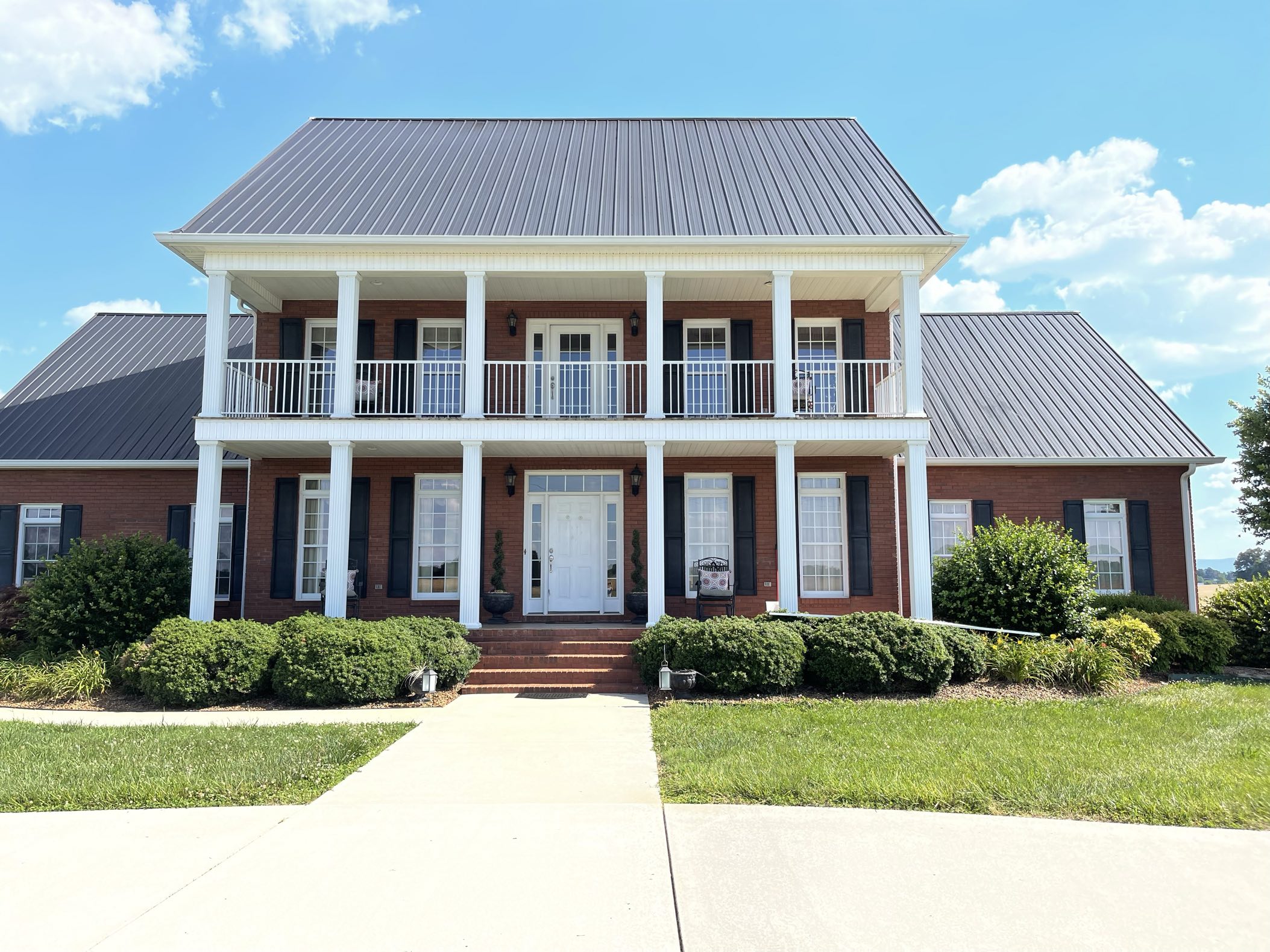 Beautiful colonial style home with metal roof